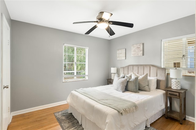 bedroom with wood-type flooring and ceiling fan