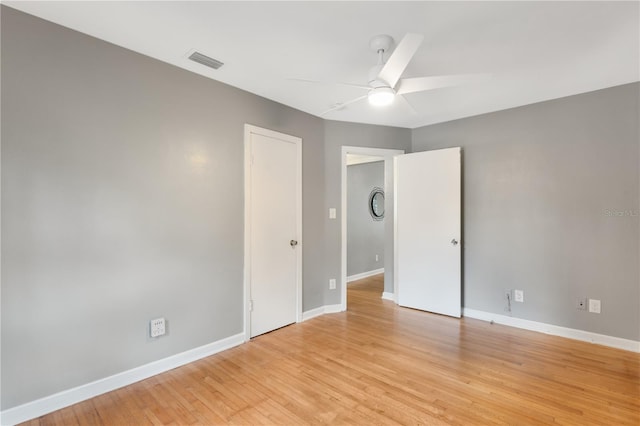 spare room featuring ceiling fan and light wood-type flooring