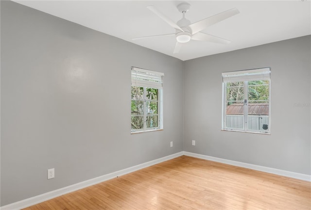 unfurnished room with ceiling fan and light hardwood / wood-style floors