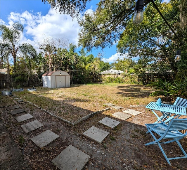 view of yard featuring a storage unit