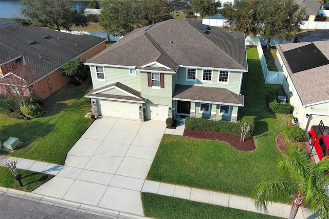 view of front of home featuring a garage and a front lawn