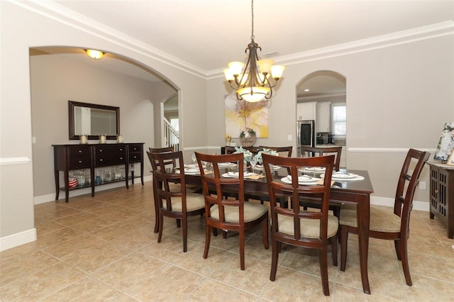 tiled dining area with crown molding and a chandelier