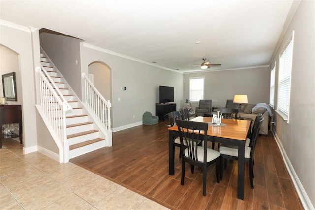 dining space with crown molding, hardwood / wood-style floors, and ceiling fan