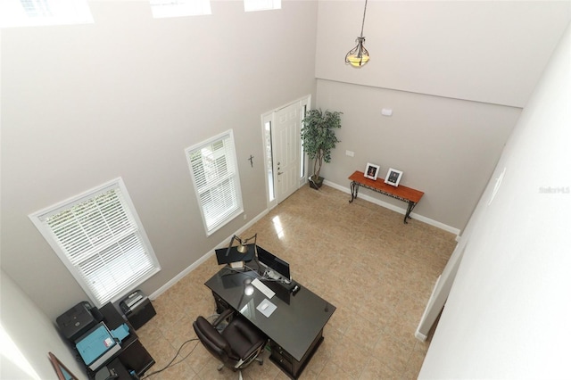 living room with a towering ceiling