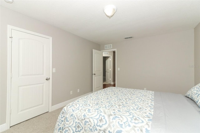 bedroom with light carpet