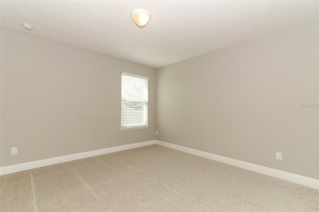 empty room featuring carpet flooring