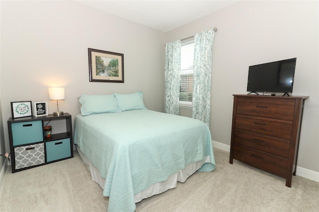 bedroom with light carpet