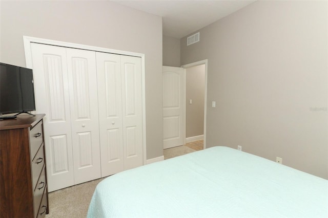 carpeted bedroom featuring a closet