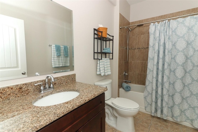 full bathroom featuring vanity, tile patterned floors, shower / bath combo with shower curtain, and toilet