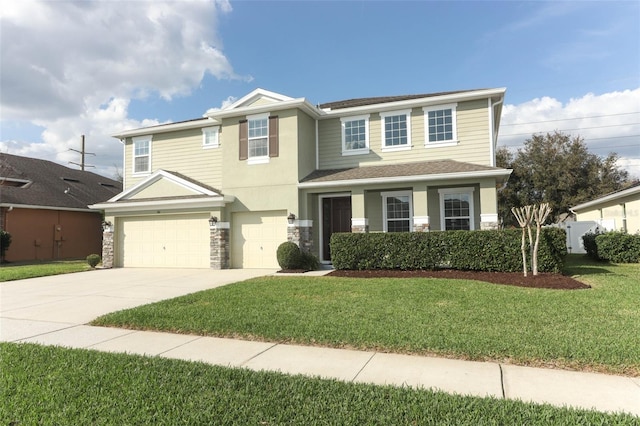 view of front facade featuring a garage and a front lawn