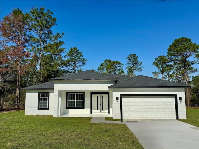 view of front of home featuring an attached garage, concrete driveway, roof with shingles, stucco siding, and a front yard