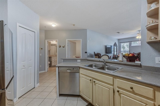 kitchen with stainless steel appliances, sink, ceiling fan, a textured ceiling, and light tile patterned flooring