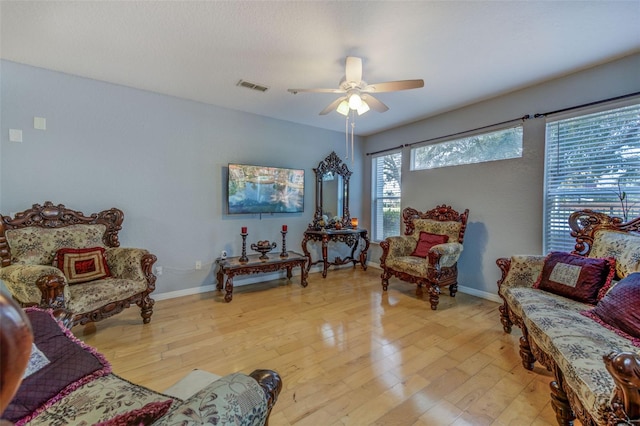 sitting room featuring light hardwood / wood-style flooring and ceiling fan