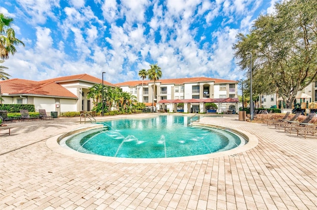 view of pool with pool water feature