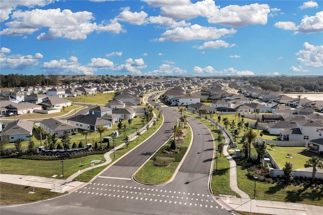 birds eye view of property with a residential view