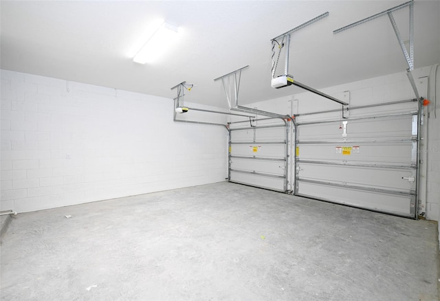 4425 Lions Gate Ave, Clermont, FL 34711 - garage with a garage door opener and concrete block wall