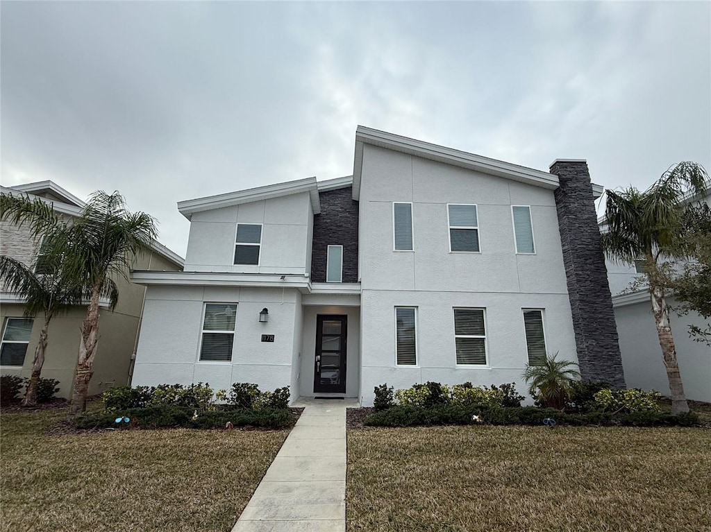 1178 Drop Ln, Kissimmee, FL 34747 - contemporary home with a front lawn