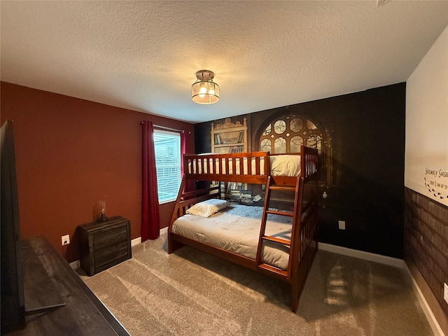 bedroom featuring carpet and a textured ceiling