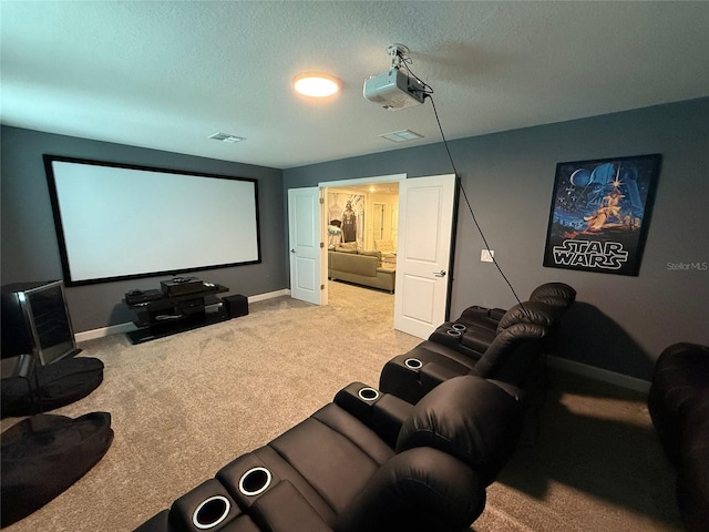 carpeted home theater room featuring a textured ceiling