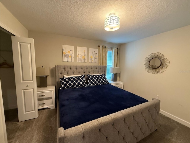 carpeted bedroom with a textured ceiling