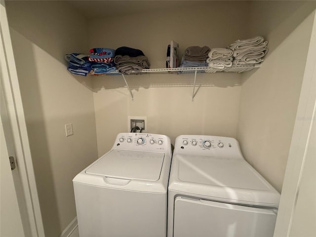 laundry area with separate washer and dryer