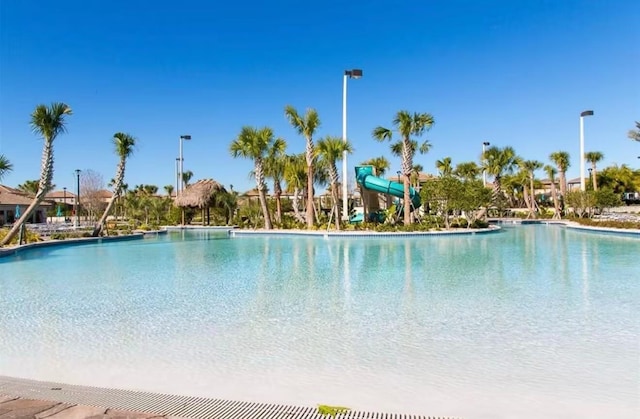 view of pool with a water slide