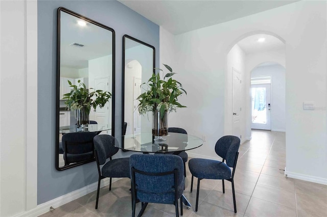 dining room featuring light tile patterned flooring