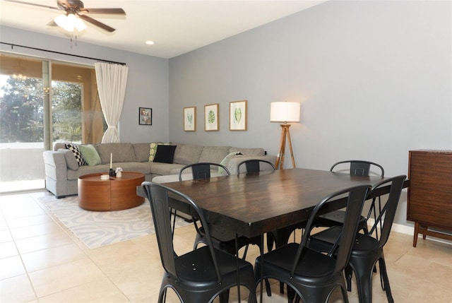 dining room featuring light tile patterned floors and ceiling fan