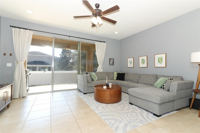 tiled living room featuring ceiling fan