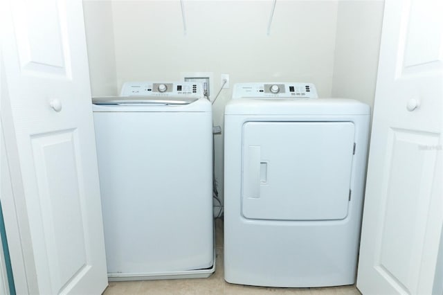 laundry area with washing machine and clothes dryer