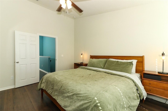 bedroom with ceiling fan and dark hardwood / wood-style flooring