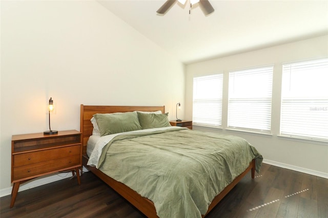 bedroom featuring ceiling fan, lofted ceiling, and dark hardwood / wood-style flooring