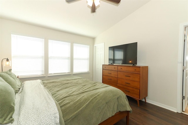 bedroom featuring lofted ceiling, dark wood-type flooring, and ceiling fan