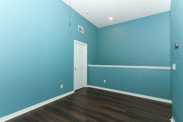 empty room featuring dark wood-type flooring