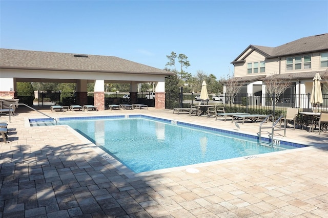 view of swimming pool with a gazebo and a patio area