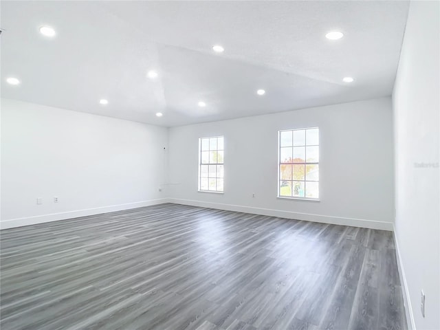 spare room with dark hardwood / wood-style floors