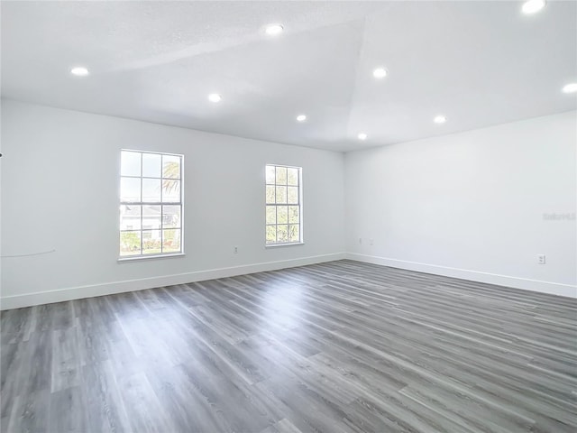 spare room with dark wood-type flooring