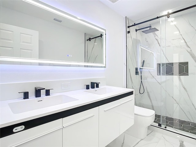 bathroom featuring vanity, an enclosed shower, and toilet