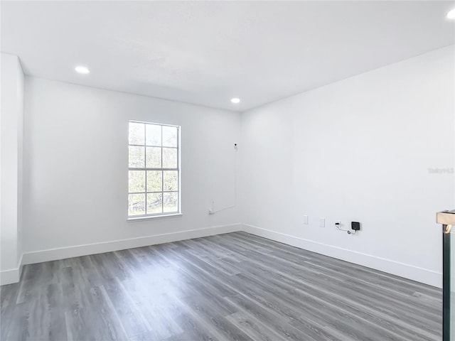 spare room featuring dark hardwood / wood-style floors