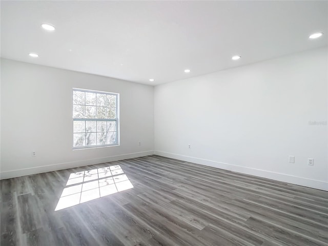 empty room featuring dark hardwood / wood-style floors