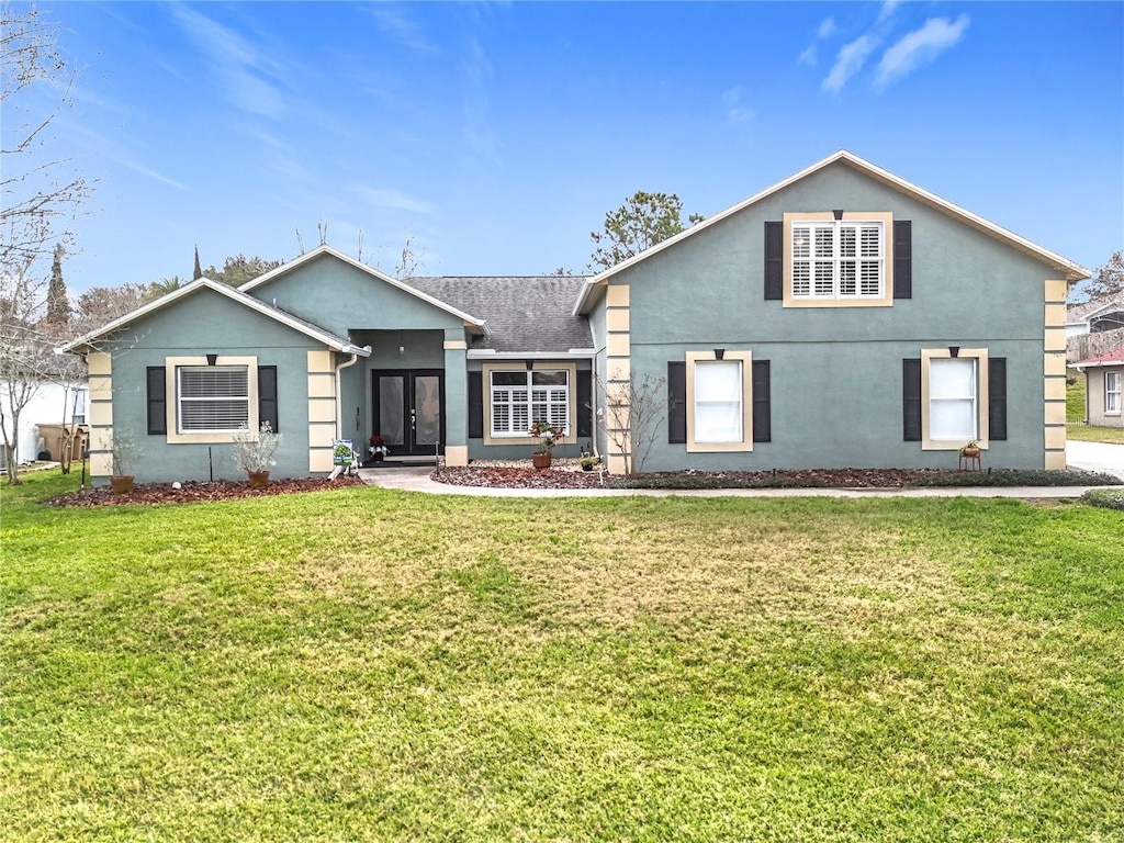 view of front of property with french doors and a front yard