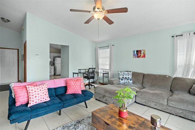 tiled living room featuring ceiling fan and lofted ceiling