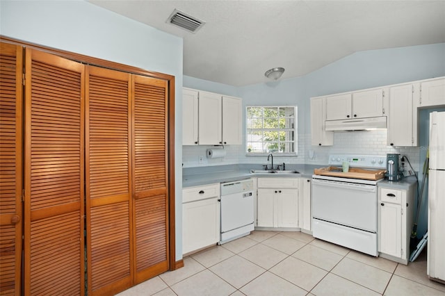 kitchen featuring white cabinetry, sink, white appliances, and backsplash