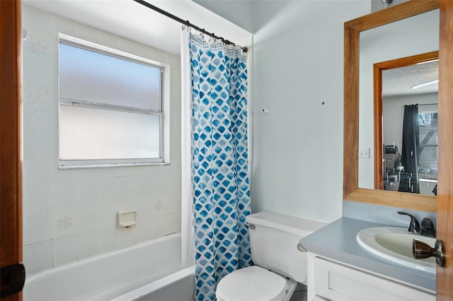 full bathroom with vanity, shower / bath combo, and toilet