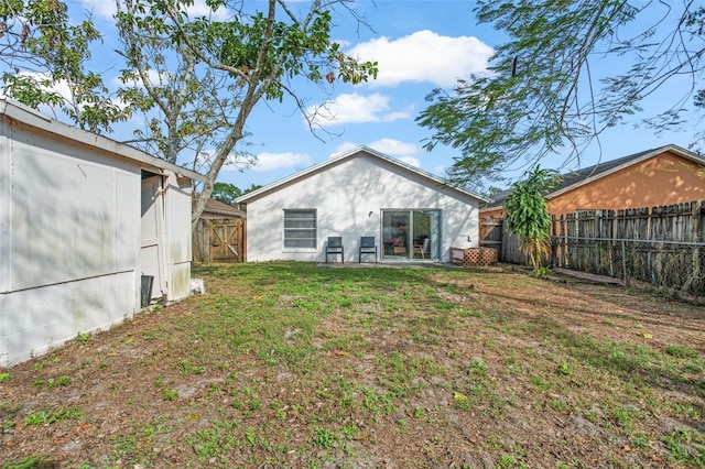 rear view of house with a lawn