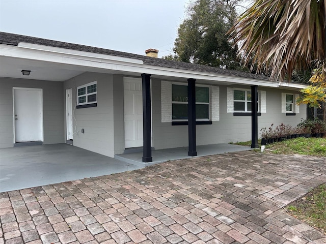 exterior space with a carport