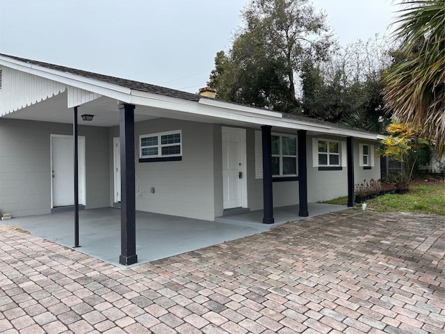 view of front of home with a carport