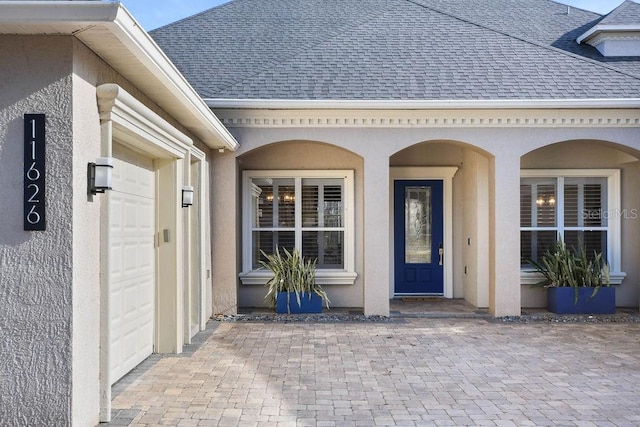 entrance to property featuring a garage