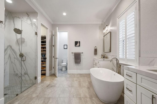 full bathroom with toilet, ornamental molding, shower with separate bathtub, and vanity