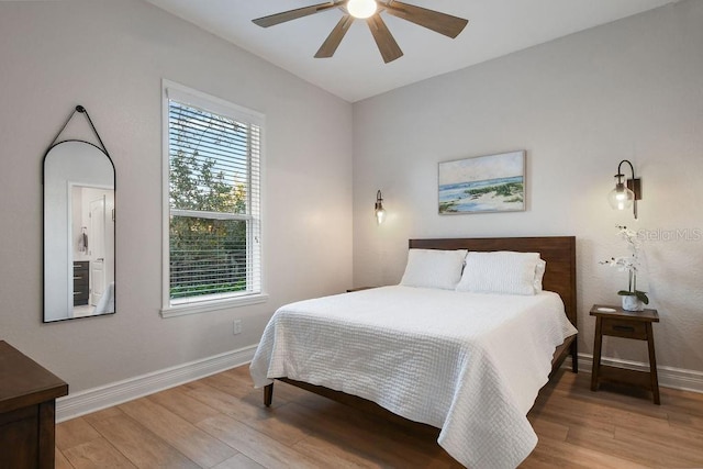 bedroom featuring hardwood / wood-style floors and ceiling fan